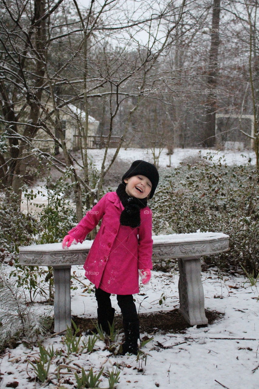 Happy girl out in the snow