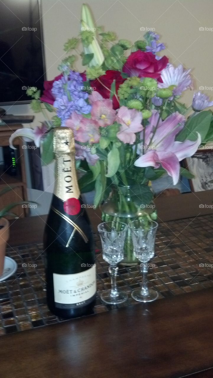 celebrate with champagne and flowers