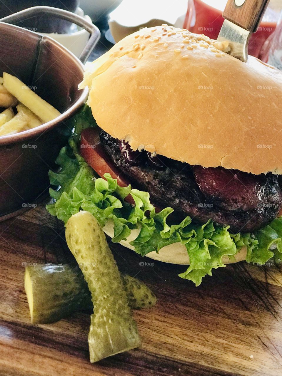 Sandwich with meat, tomato, salad and pickle