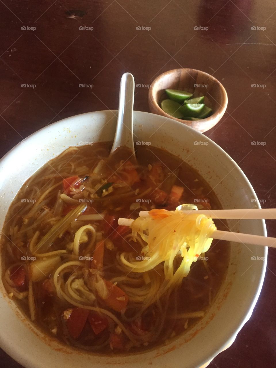 oriental soup with chop  sticks
