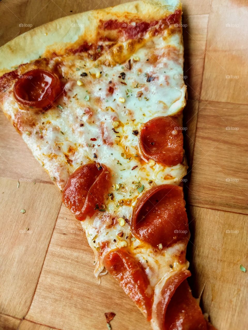 slice of fresh pepperoni pizza