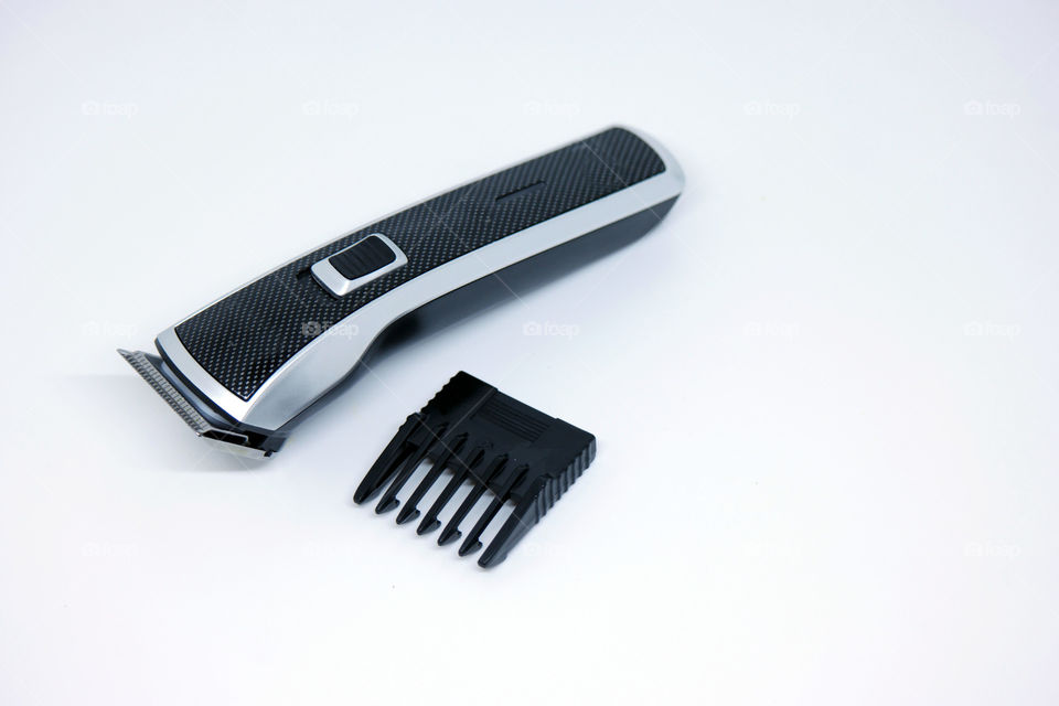 Black and silver hair trimmer on white background