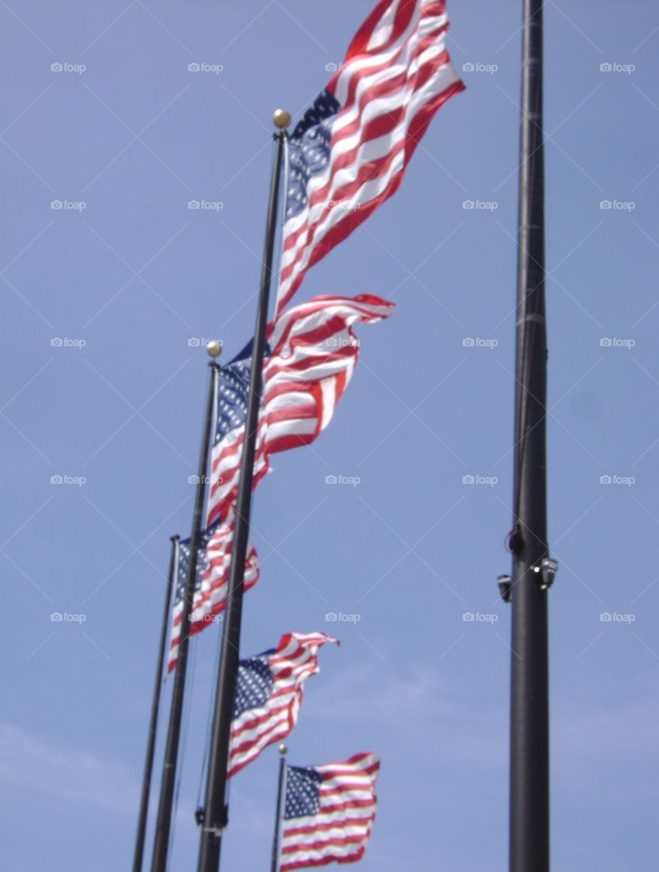 American flags blowing in wind. Photo taken at Navy Pier in Chicago.  U.S. Flags blowing in the wind.