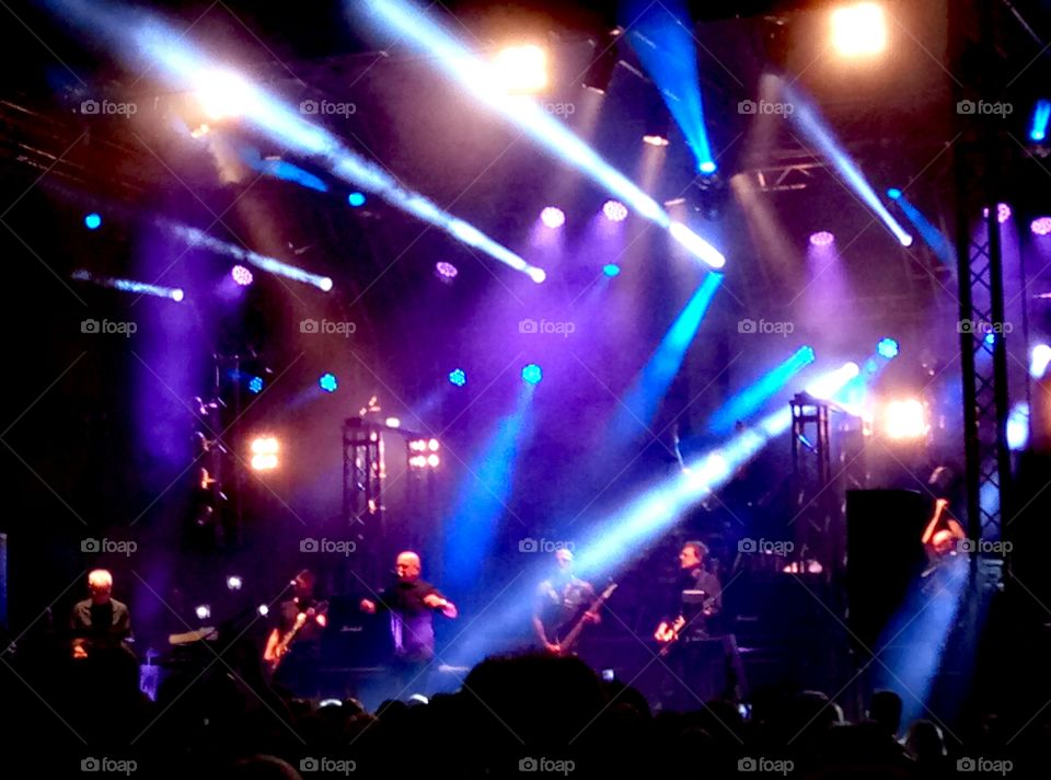 Rock concert, blue lights on the band