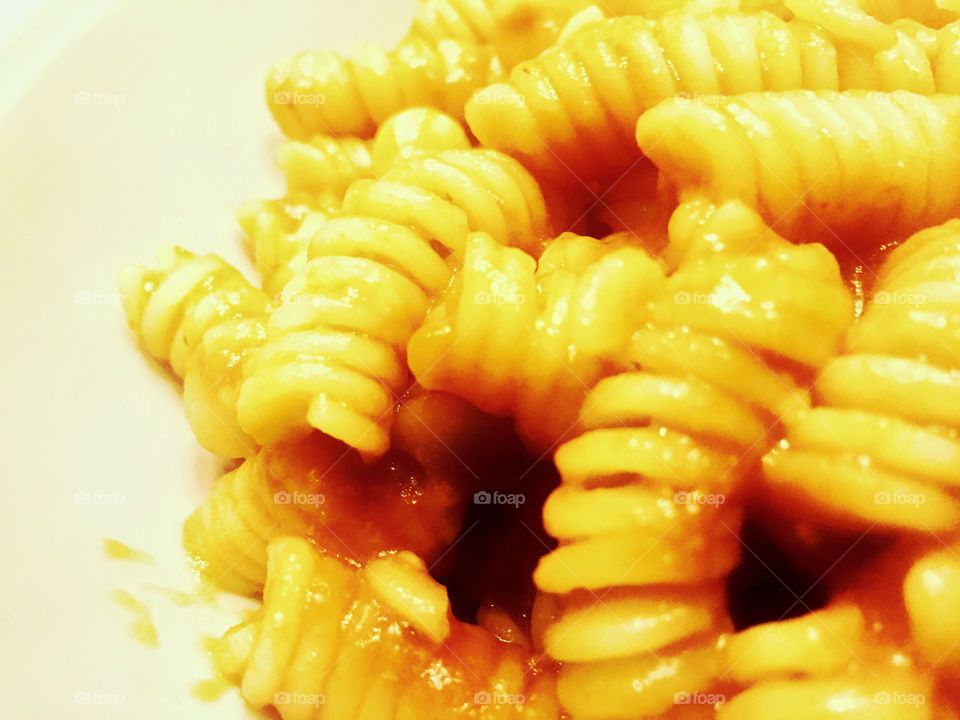 Close up of fusilli pasta with tomato sauce