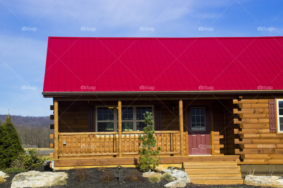 Red top wooden house