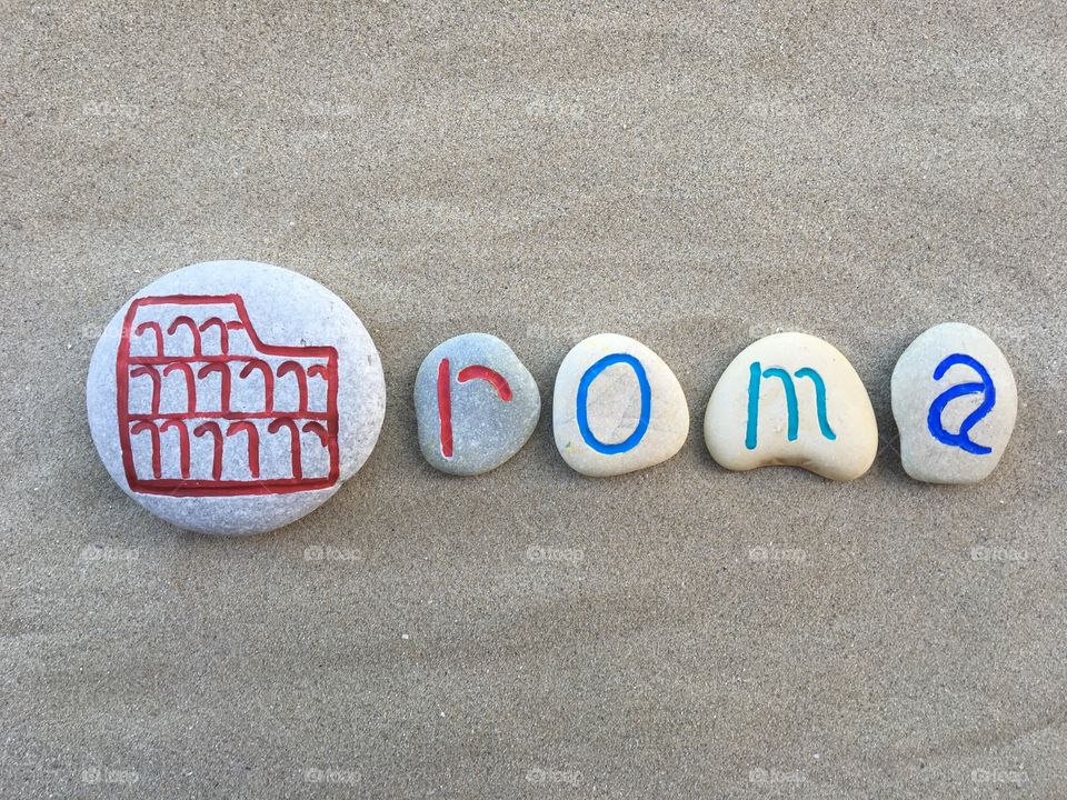 Colosseum, symbol of Rome on carved stones 