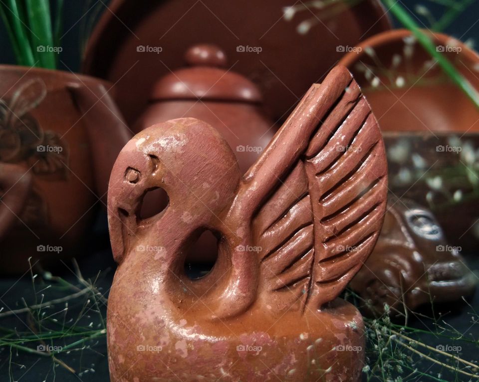 old swan statue against the potter