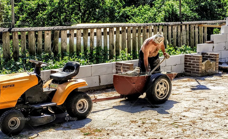 The sculptor is constantly working. (Lithuania, Druskininkai, July, 2019).