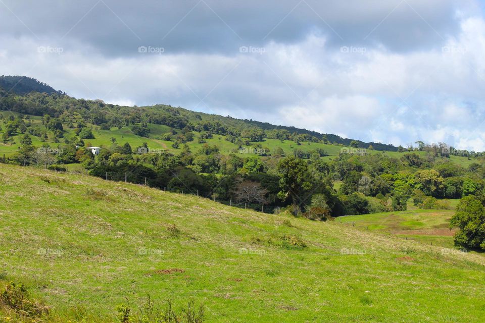 Summer landscape.  Beautiful green hills with lush tropical vegetation.  Costa Rica