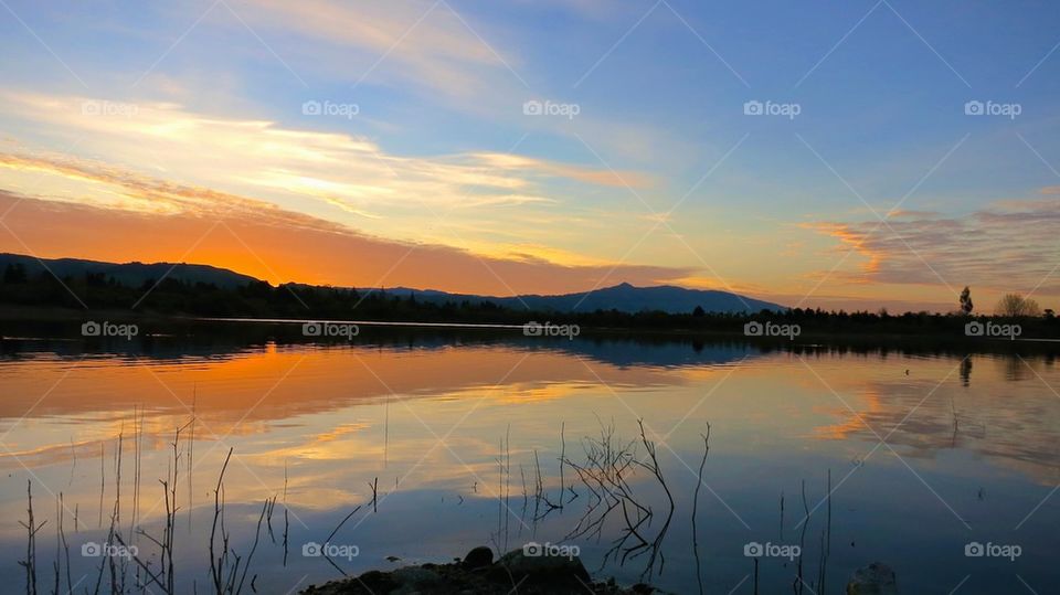 Scenic view of idyllic lake during sunrise