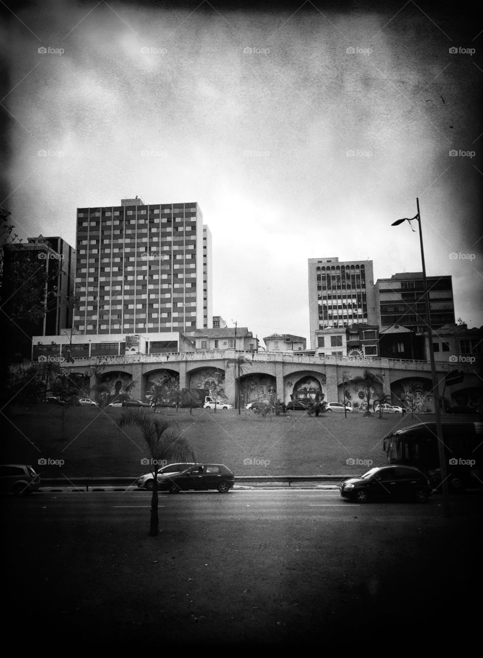 Cityscape with architectural arches in a cloudy day 