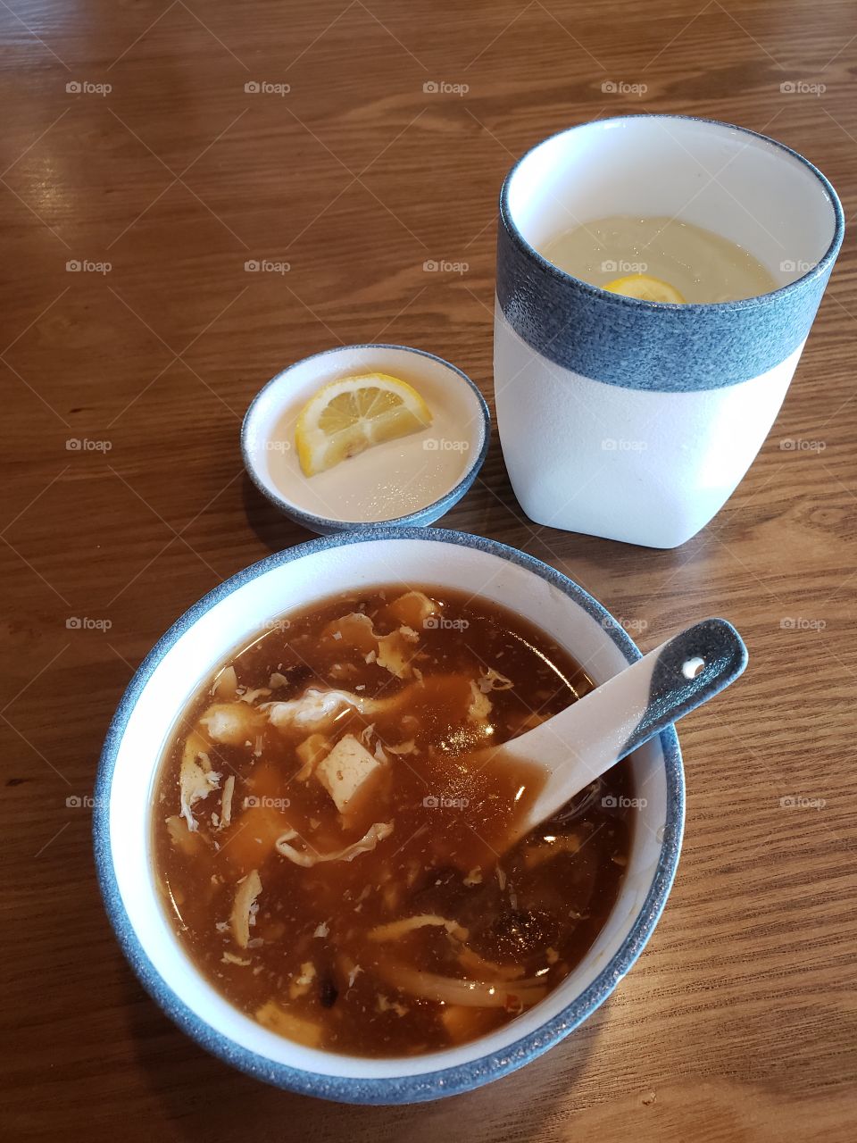 hot sour soup and a cup of water.