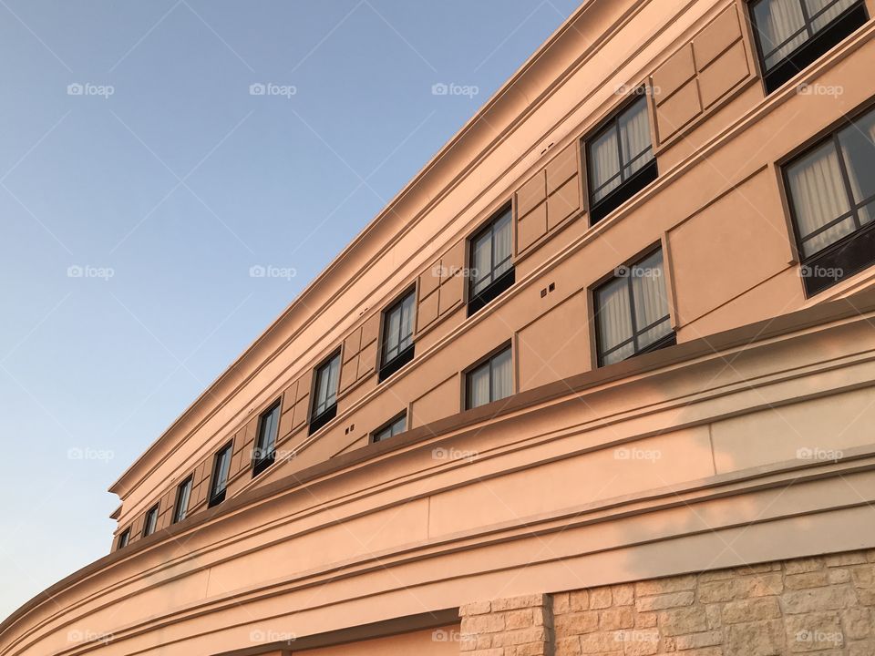 Modern hotel facade sunset