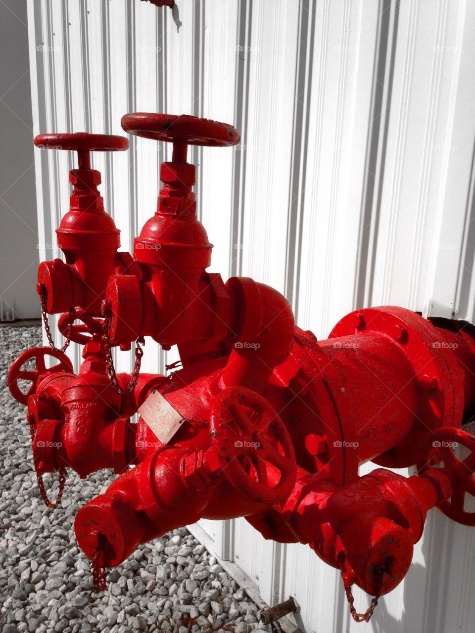 Close-up of a red industrial valve