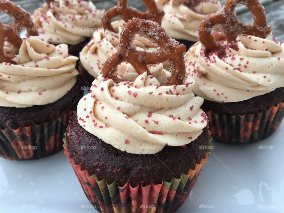 Milk Chocolate Cupcake with Caramel Buttercream with Cinnamon Sugar Pretzel 