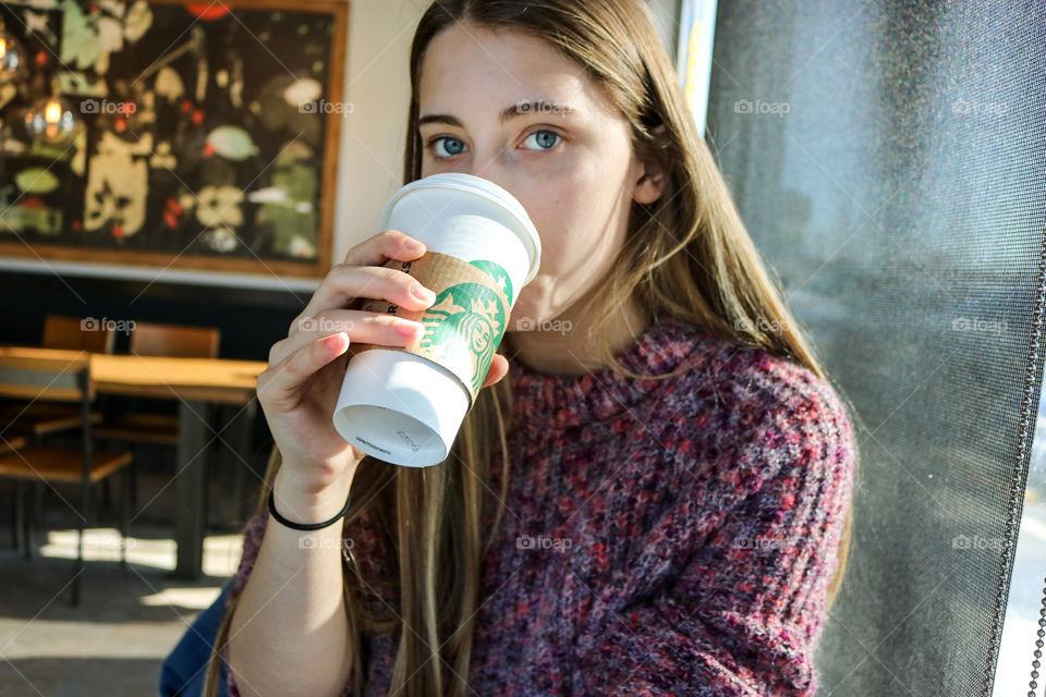 Starbucks- drinking a latte.