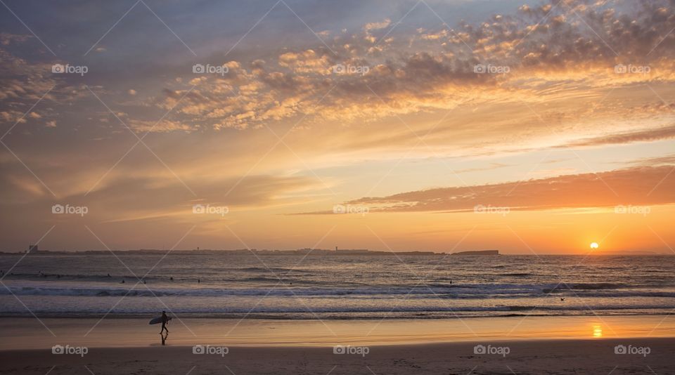 surfer silhouette by the ocean