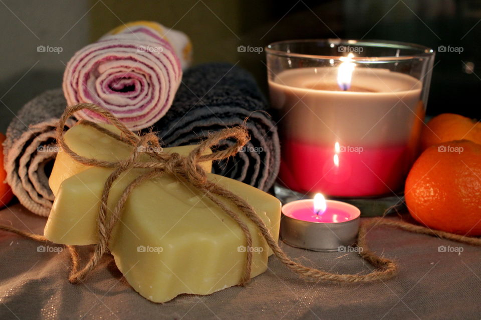 Homemade soap, candles and hot water - relax time in bathroom in winter