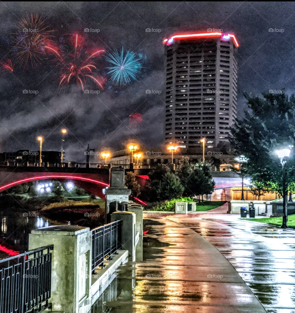 city night time fireworks festival wet bridge