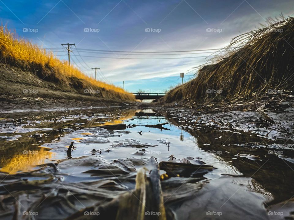 Empty canal’s reflection.