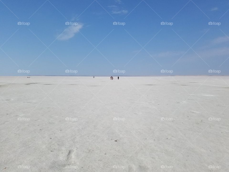 people in the distance in the middle of the salt lake in Sereflikochisar Turkey