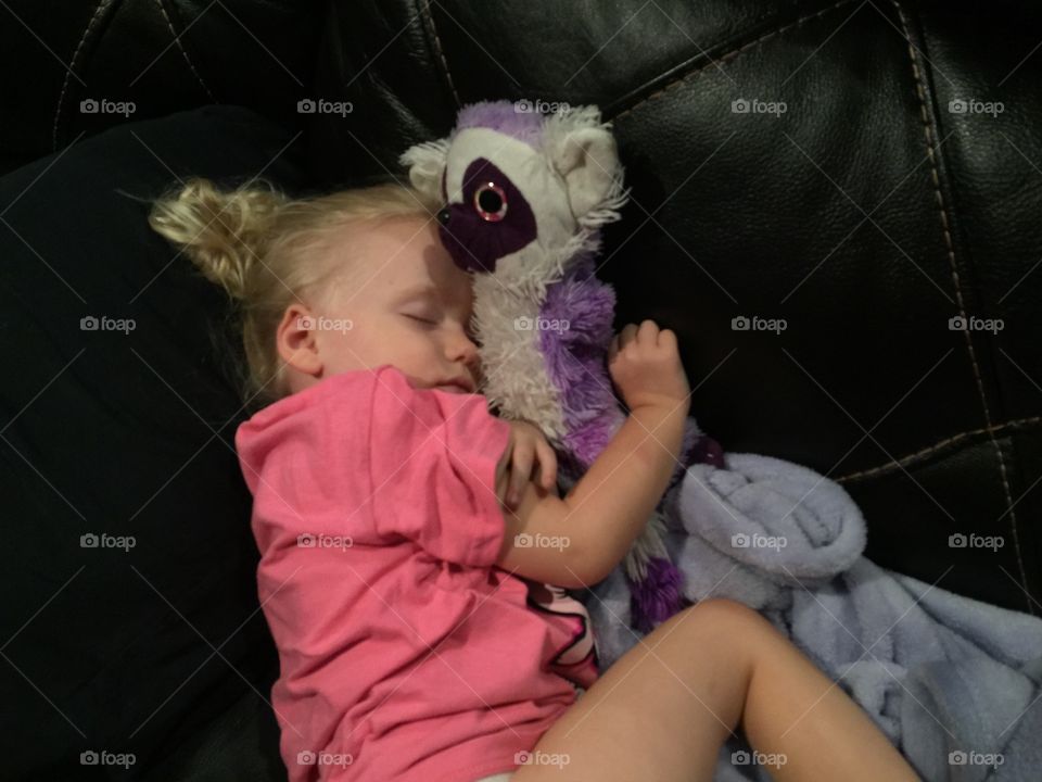 Cute baby sleeping with toy