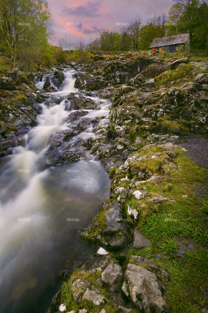 Flowing river near Ashness Bridge. At twilight 