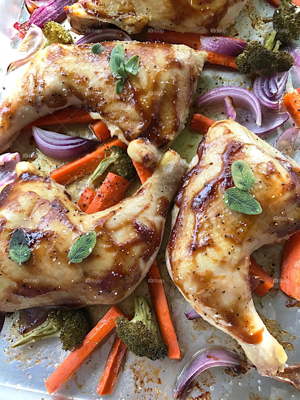 Chicken dinner on baking sheet 