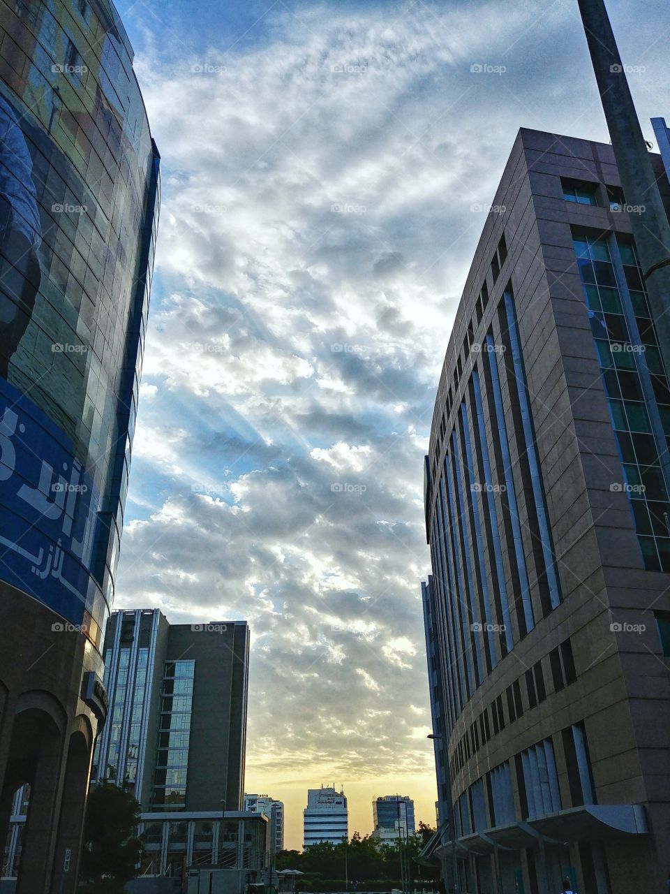 Clouds among city buildings