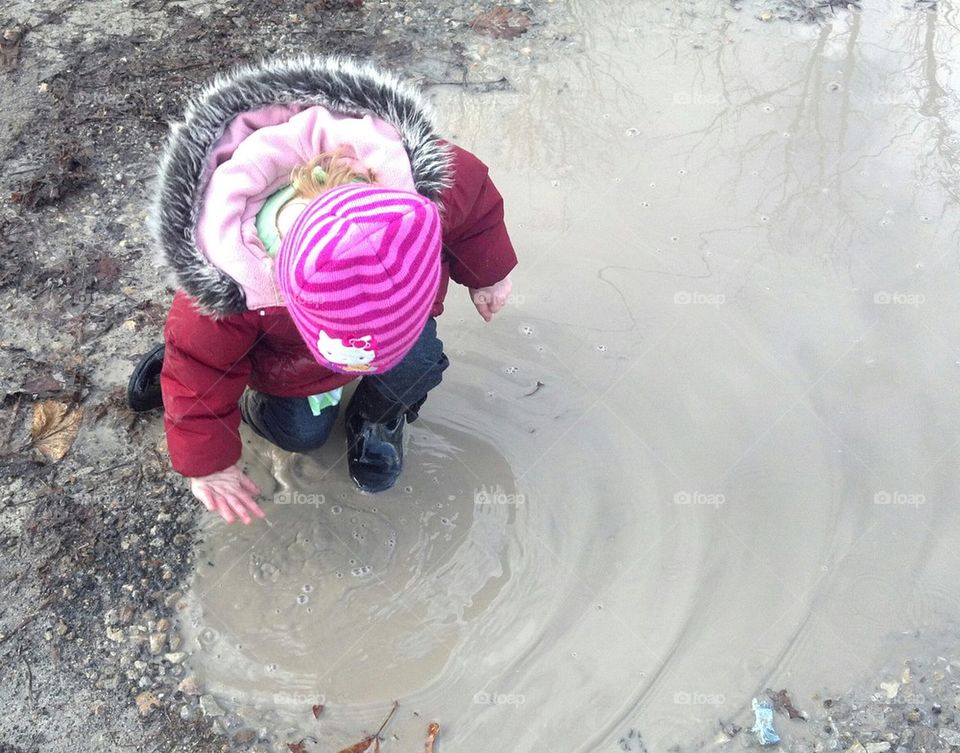 playing in puddles
