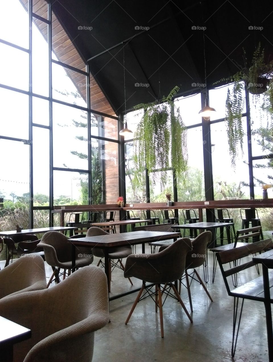 Restaurant decoration, wide window, tables and chairs