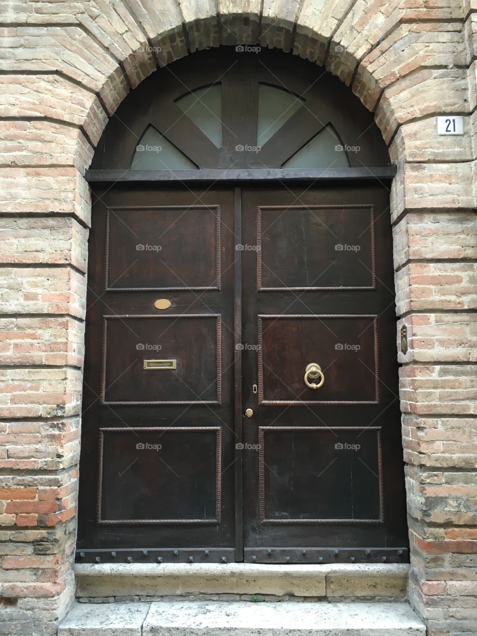 Brown wooden door, Offida, Italy