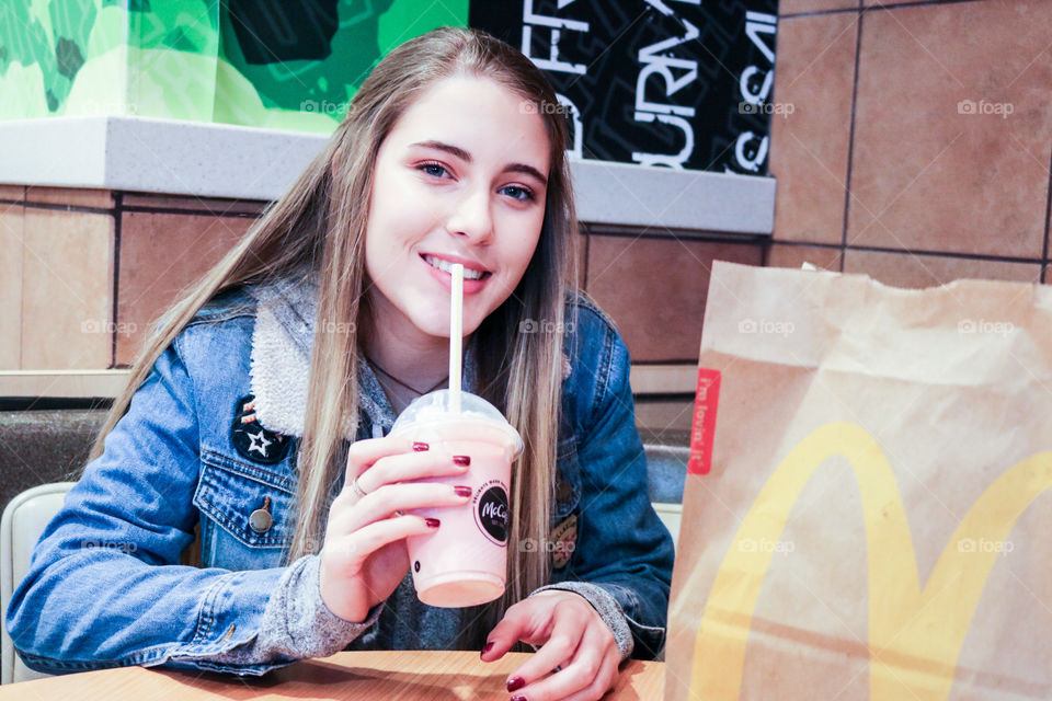 McDonald’s - enjoying her favorite milkshake . 