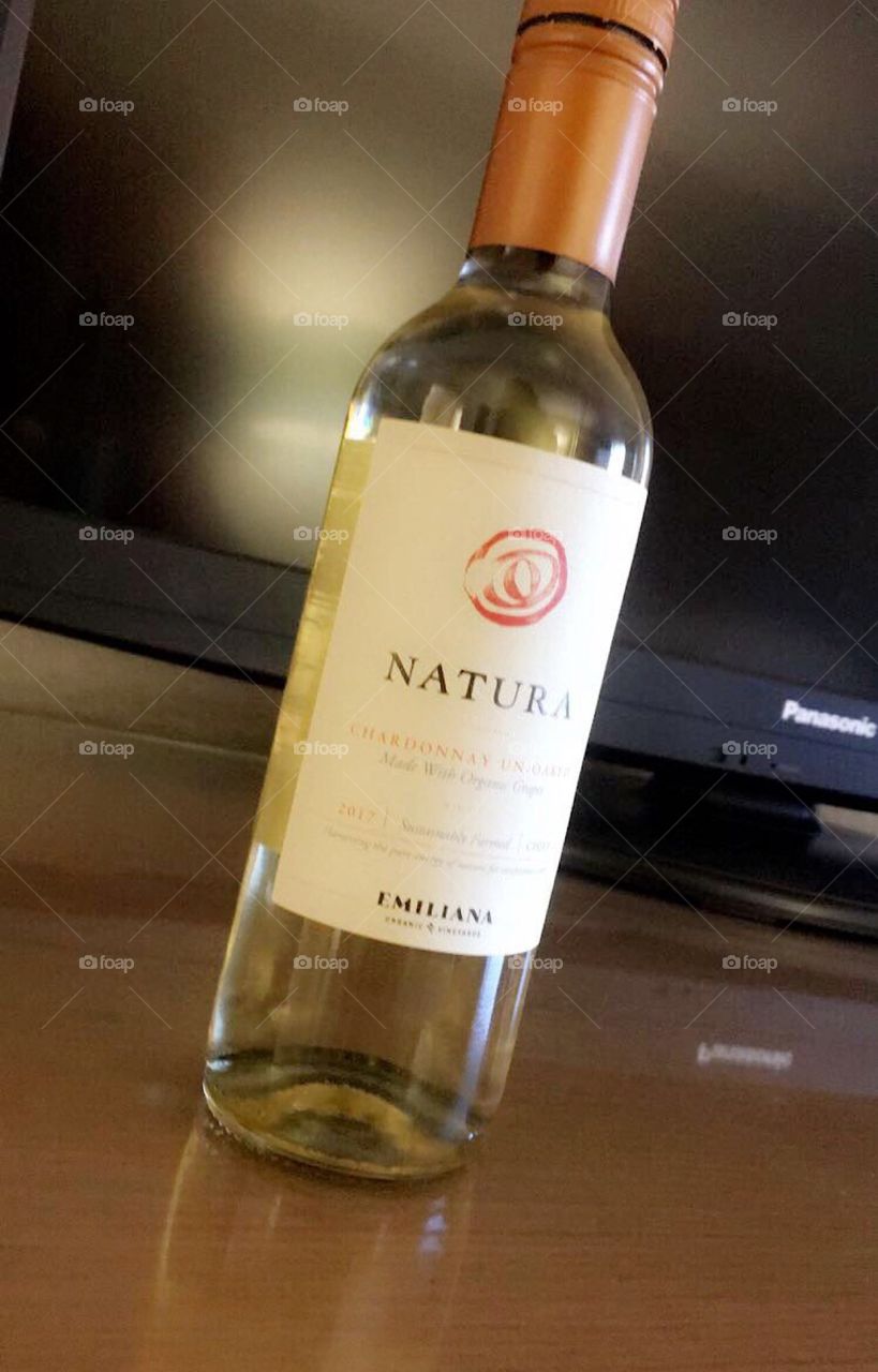 Fancy wine bottle sitting on the table
