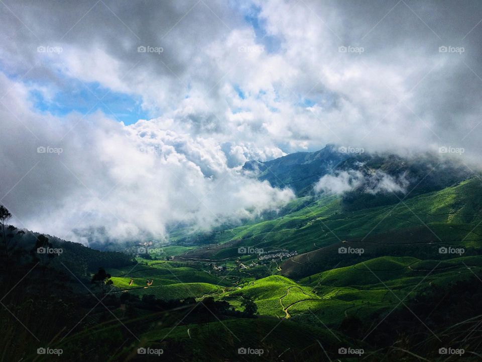 Clouds descending to a green valley