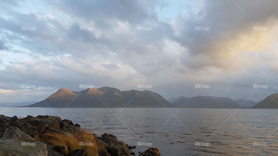 A quiet place in the sunset with mountains in background. Norway.