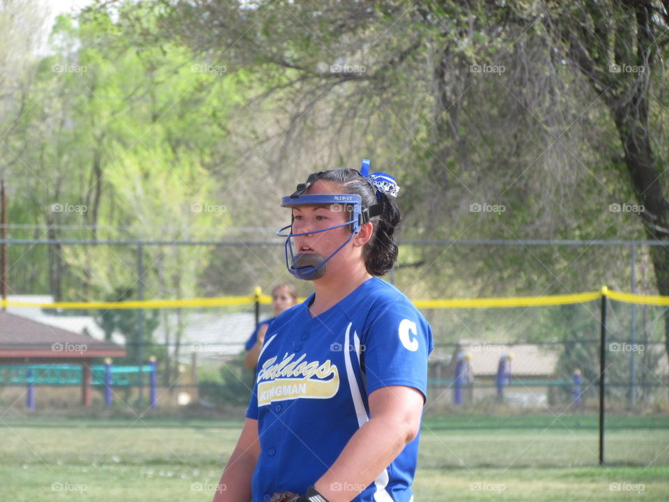 pitcher. close up of my daughter in the pitcher circle during varsity softball game