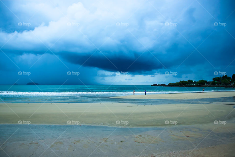 Rain is coming at the beach.