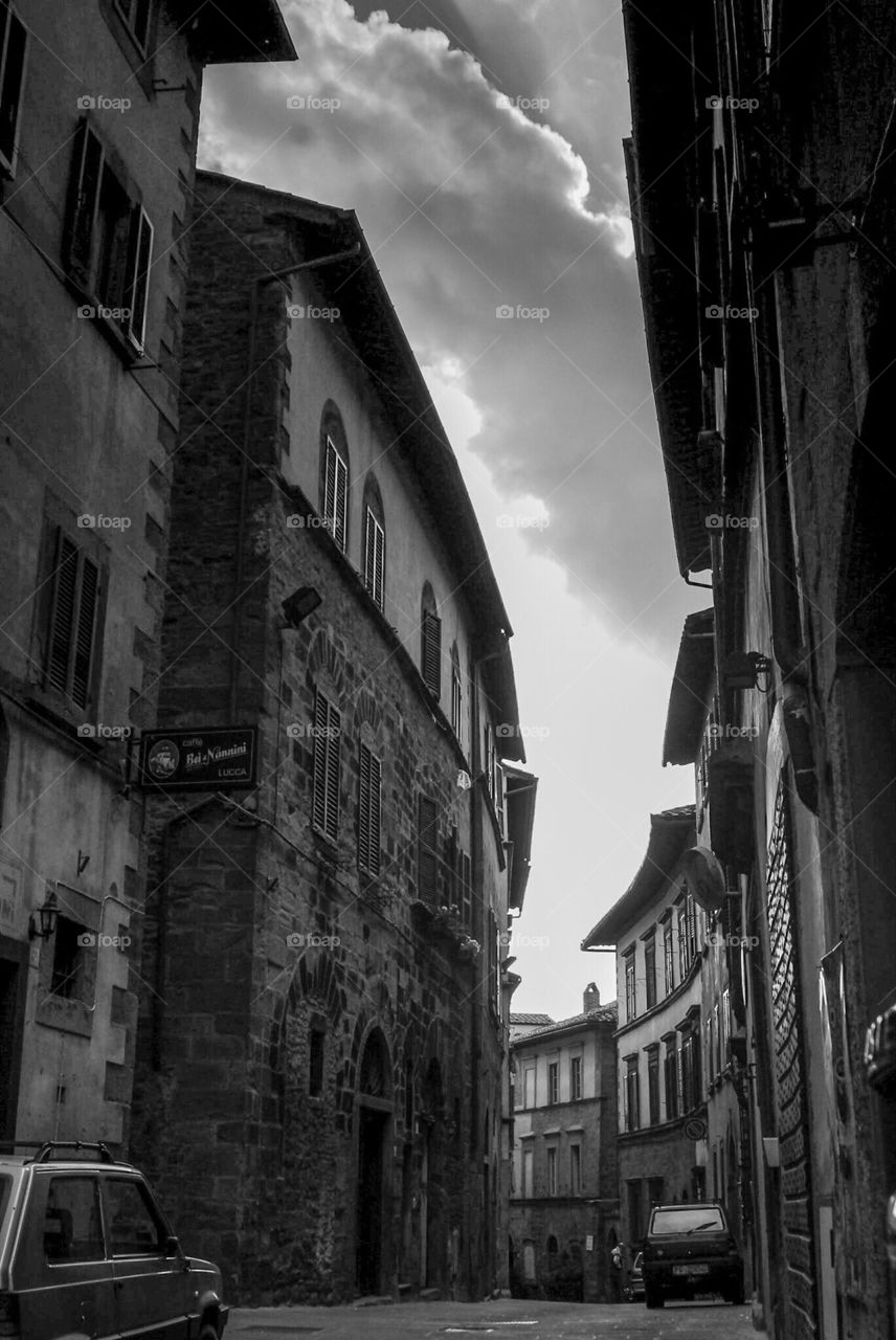 Narrow street between high housing