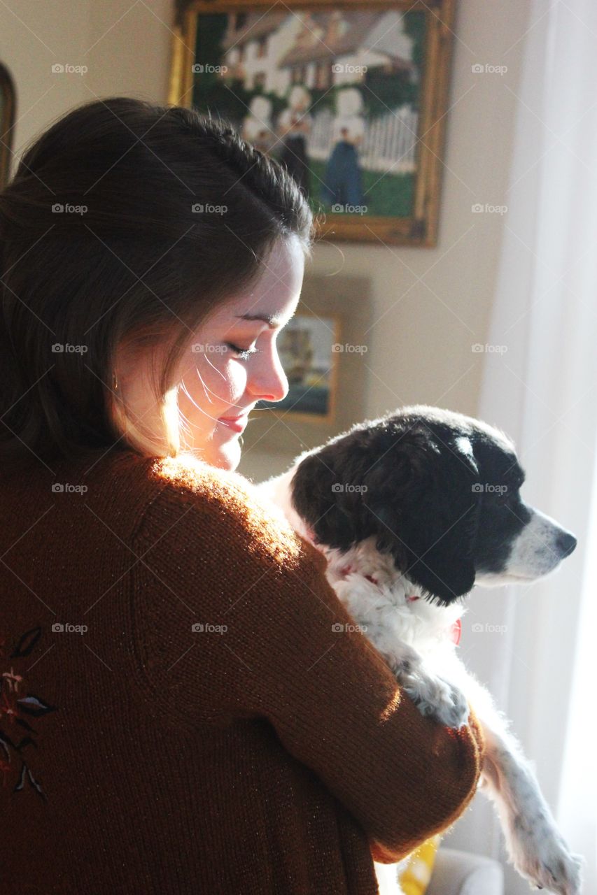 a girl and her dog side profile