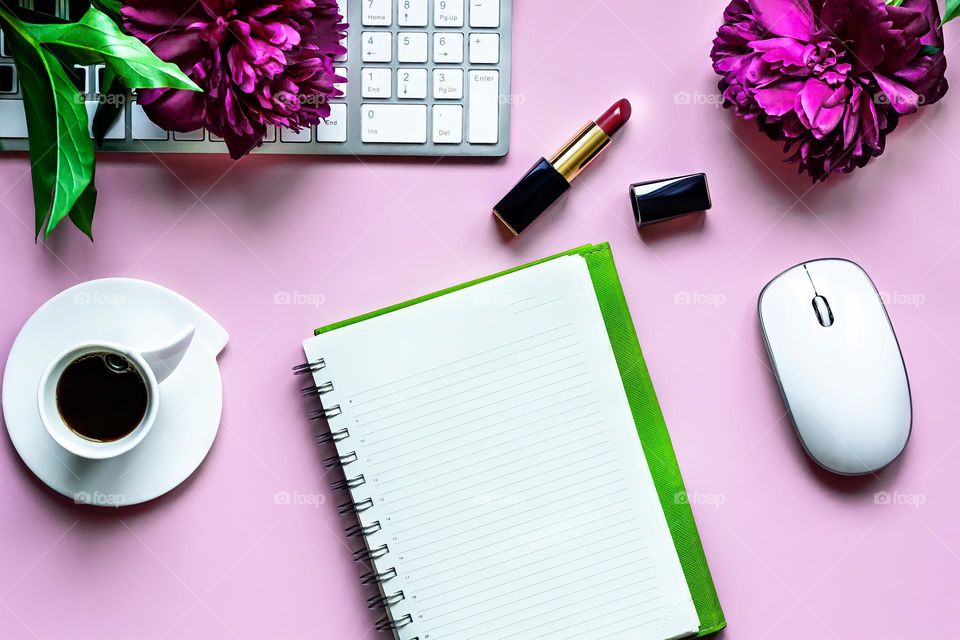 Flat lay view of work desk notepad for notes, coffee and women's accessories, day planning