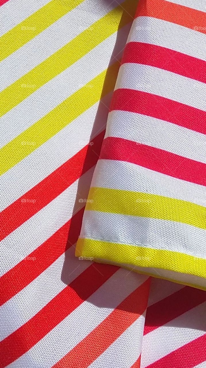 cloth material striped white red yellow yard sale Outdoors sunlight
