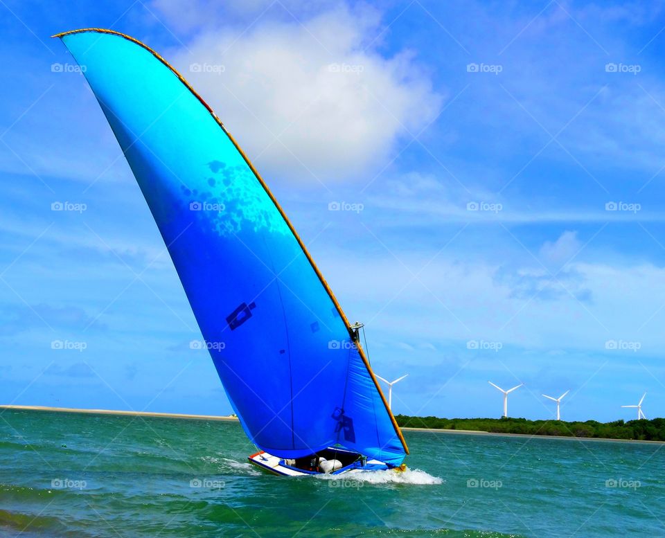 A blue sailboat. A blue sailboat in Brazil 