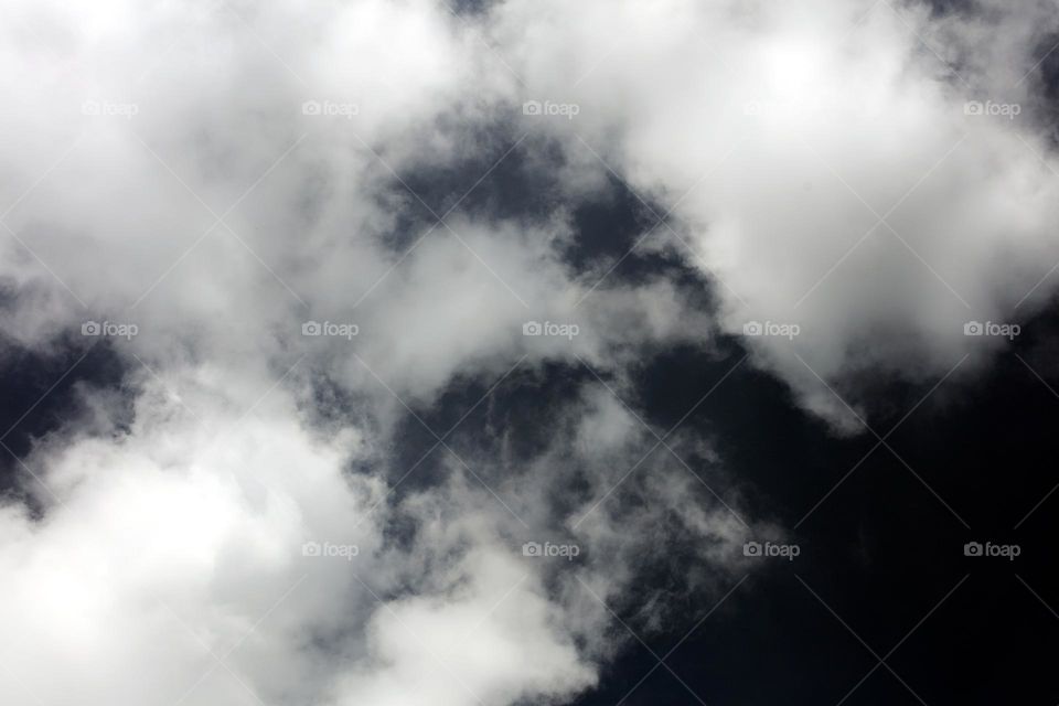 Black sky with clouds trippy psychedelic minimalistic background winter season daydreaming