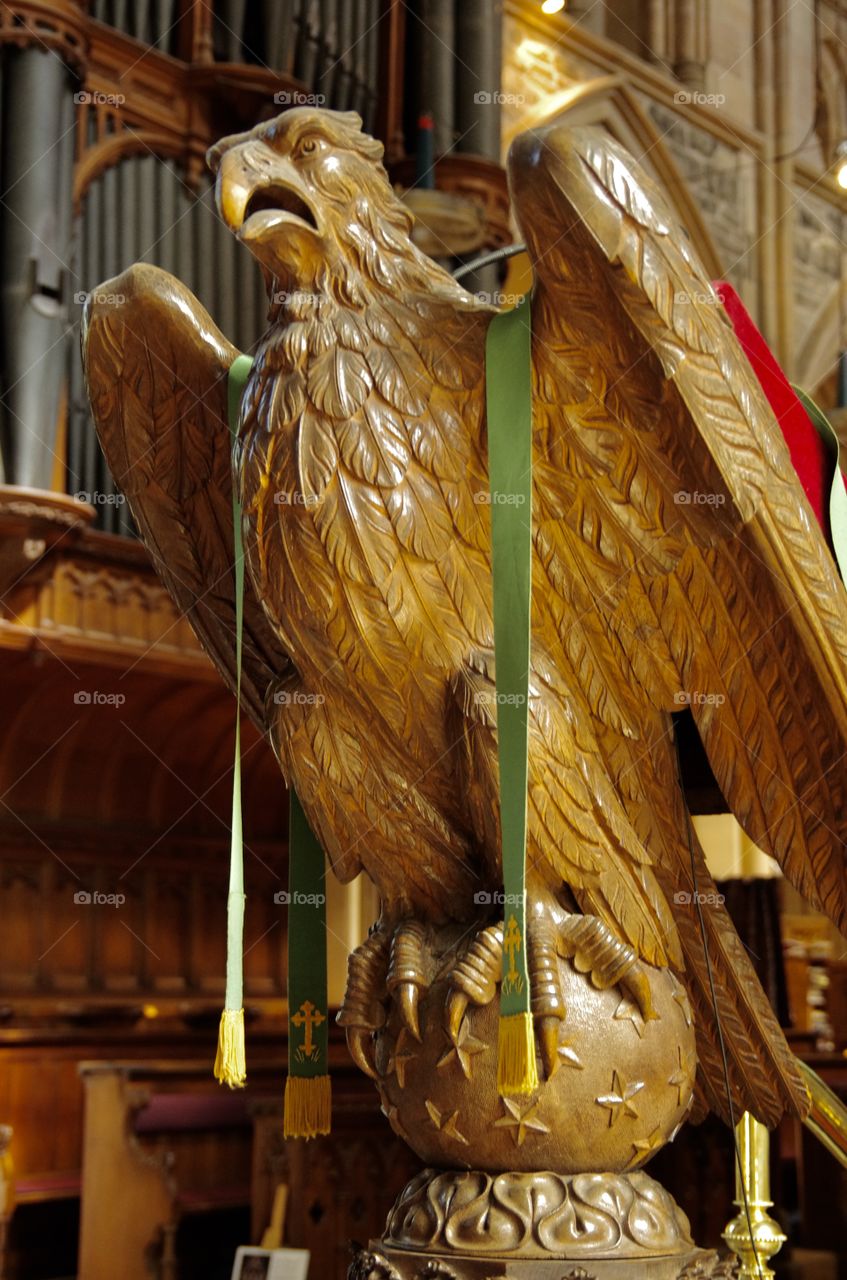 Interior.  St. John’s, Newfoundland.  Anglican church.  A carved wooden eagle.  Background:  organ pipes.