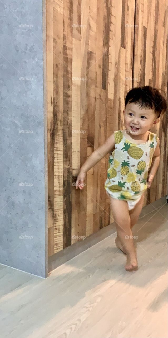 Asian kid model happily in tee shirt and nappy