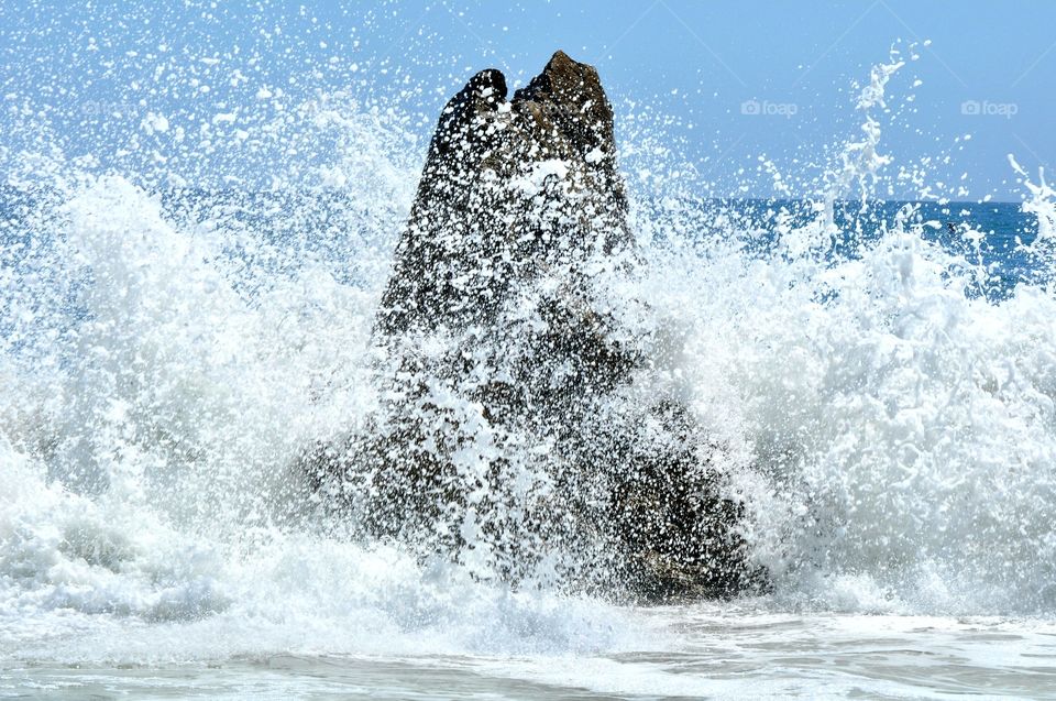 Waves crashing on the rock