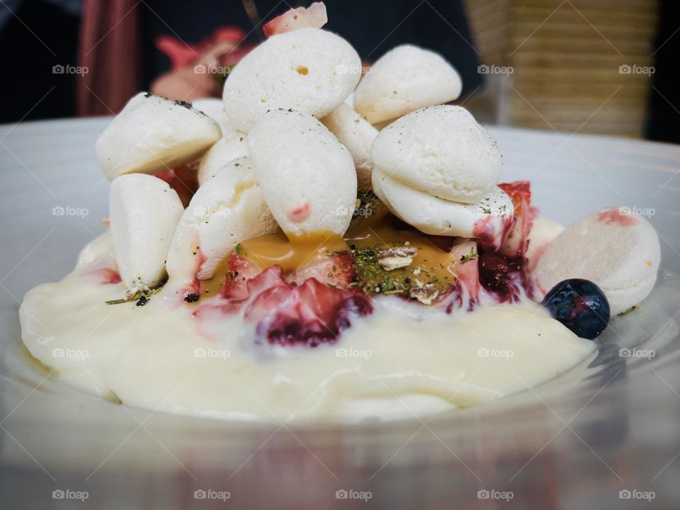 Meringue biscuit dessert with some fruits 