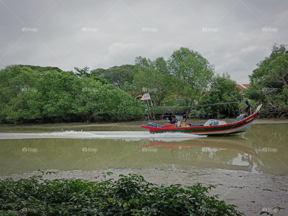 A fisherman boat move to the sea